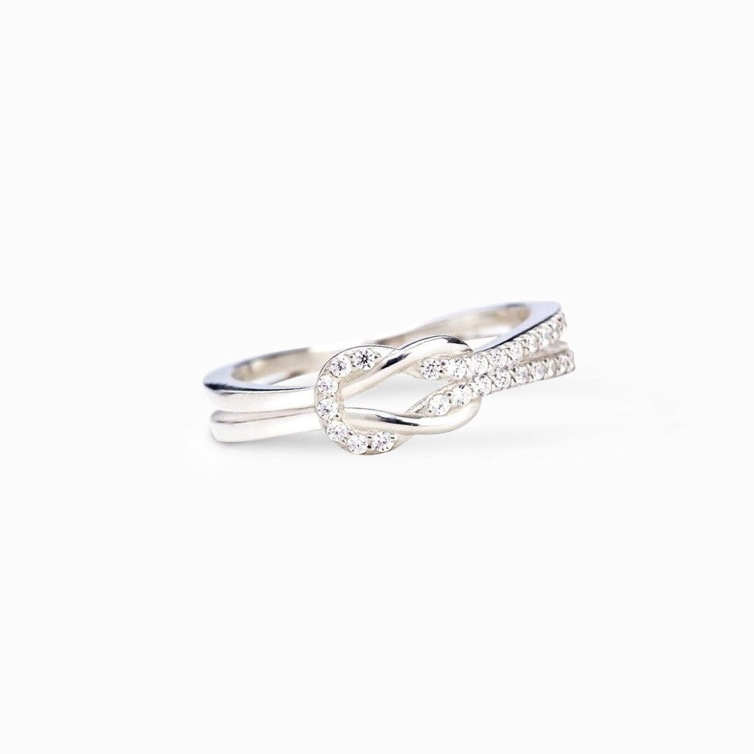 Isolated white background image of a beautiful love knot sterling silver ring to celebrate best friends relationships